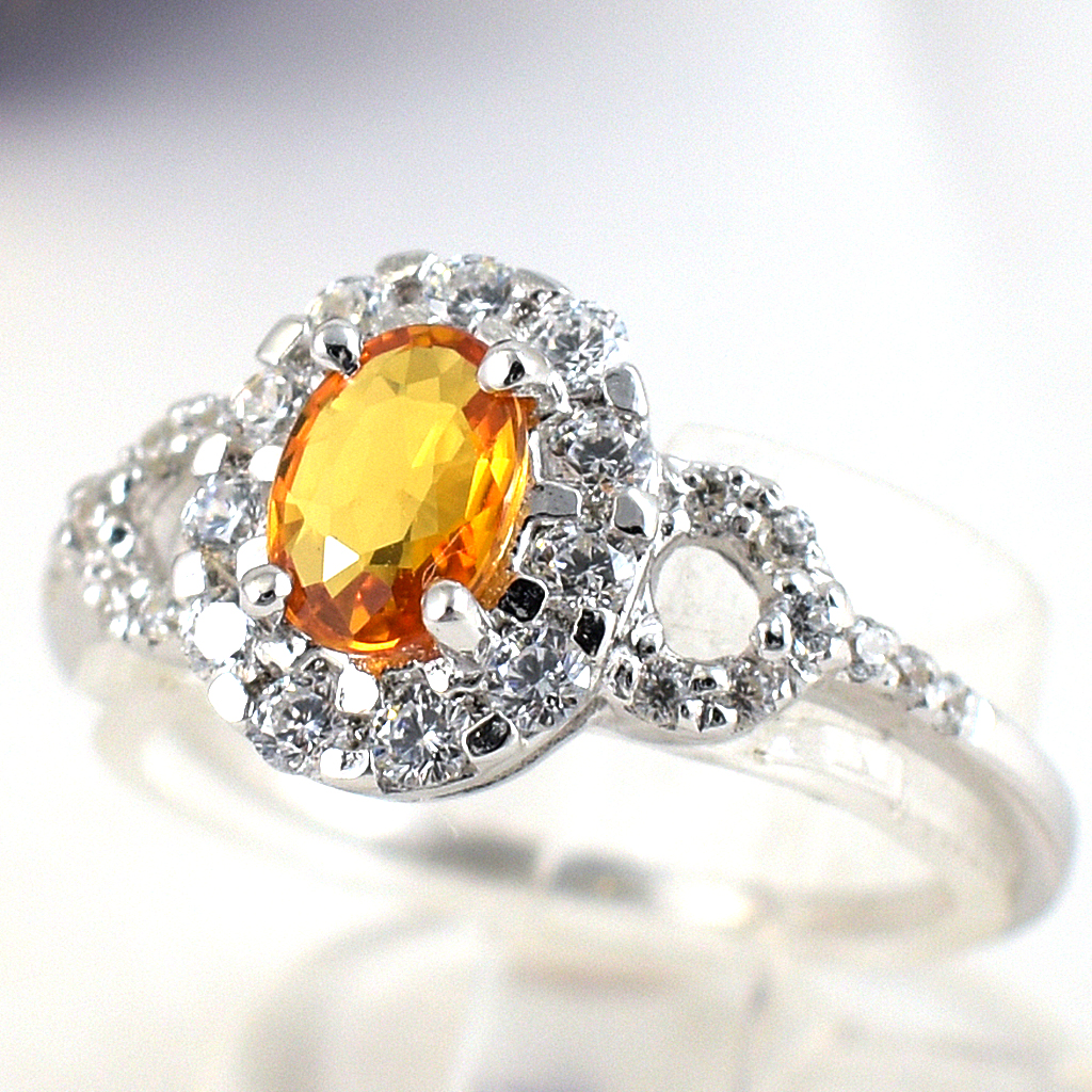 แหวนเงินแท้ราคาถูกชุบทองคำขาว บุษราคัมแท้ 0.60 กะรัต เพชรCZ 1.06 กะรัต งานประณีตสวยงาม สั่งผลิตค่ะ