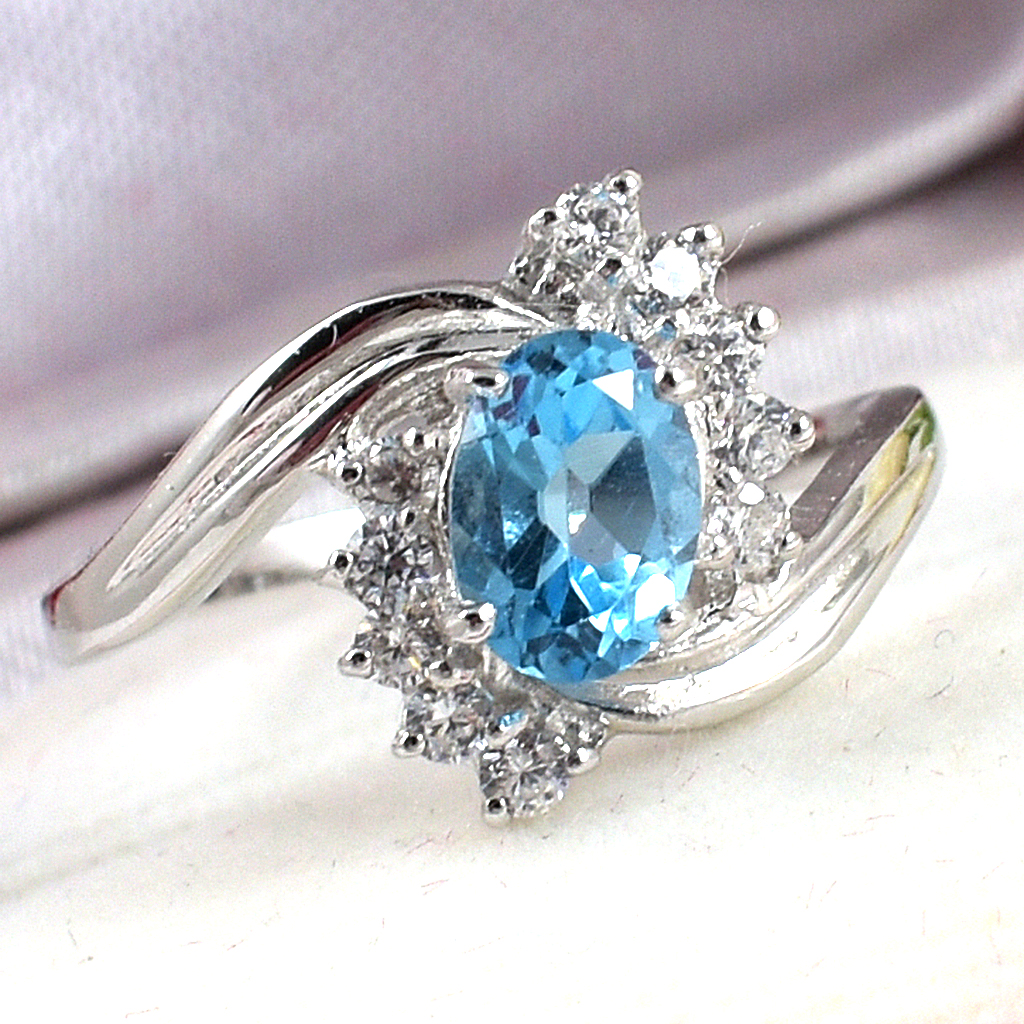 แหวนเงินแท้ราคาถูกชุบทองคำขาว สวิสบลูโทปาซแท้ 1.05 กะรัต เพชรCZ 0.10 กะรัต งานประณีตสวยงาม สั่งผลิตค่ะ