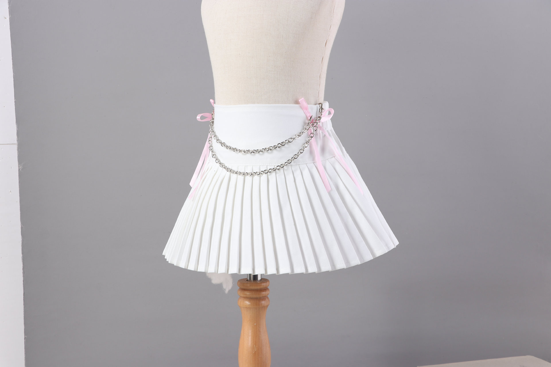 กระโปรง เด็กผู้หญิง อัดพลีส สีพื้นแยกสร้อม**พร้อมแบบโบว์ชมพู