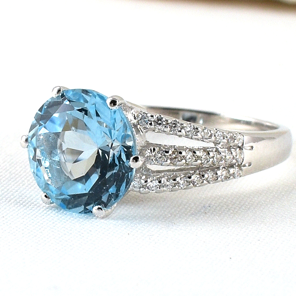 แหวนเงินแท้ราคาถูกชุบทองคำขาว สกายบลูโทปาซแท้ 4.55 กะรัต เพชรCZ 0.322 กะรัต งานประณีตสวยงาม สั่งผลิตค่ะ