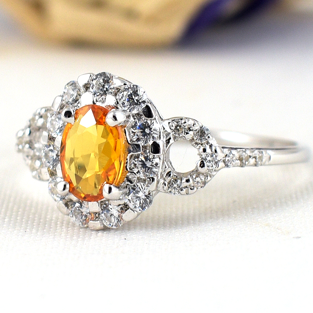 แหวนเงินแท้ราคาถูกชุบทองคำขาว บุษราคัมแท้ 0.60 กะรัต เพชรCZ 1.06 กะรัต งานประณีตสวยงาม สั่งผลิตค่ะ