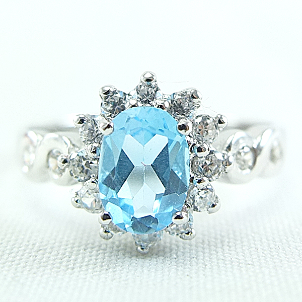 แหวนเงินแท้ราคาถูกชุบทองคำขาว สวิสบลูโทปาซแท้ 0.95 กะรัต เพชรCZ 0.40 กะรัต งานประณีตสวยงาม สั่งผลิตค่ะ