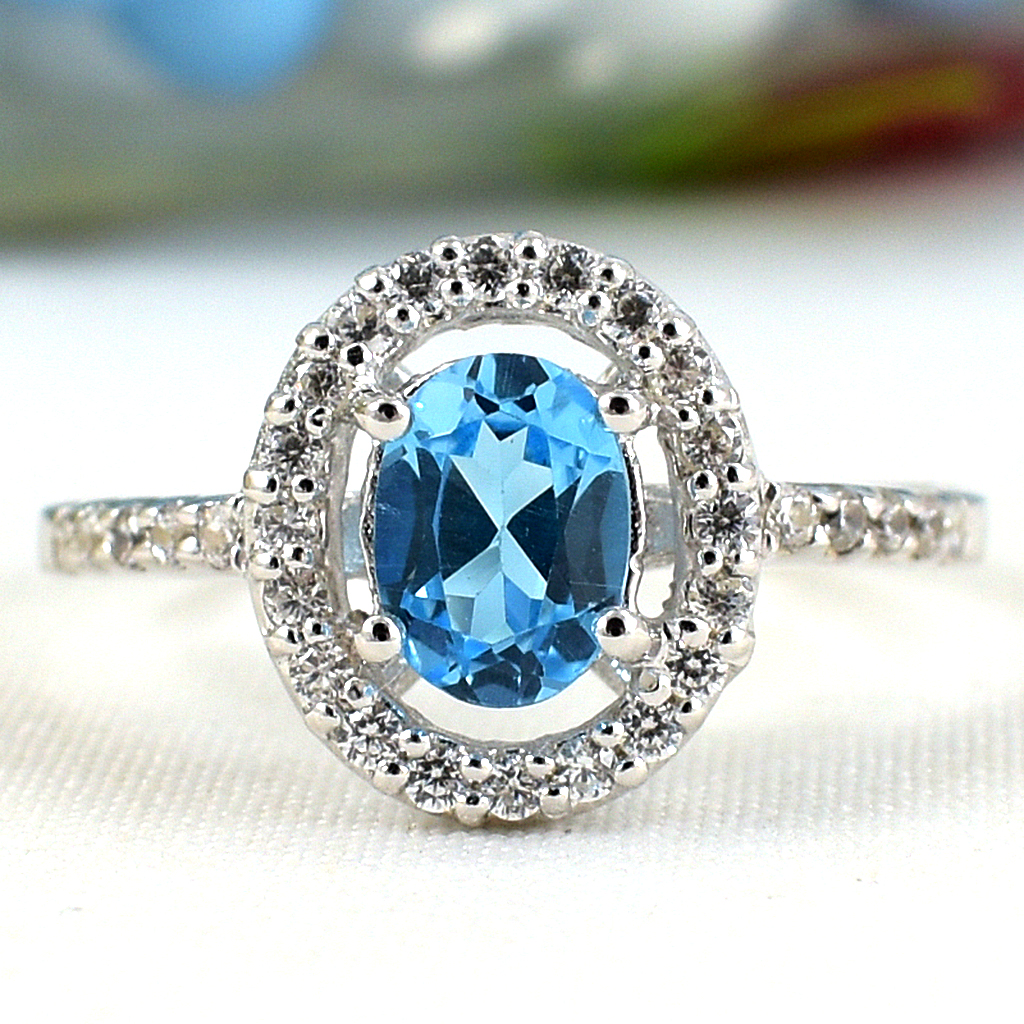 แหวนเงินแท้ราคาถูกชุบทองคำขาว สวิสบลูโทปาซแท้ 0.95 กะรัต เพชรCZ 0.30 กะรัต งานประณีตสวยงาม สั่งผลิตค่ะ