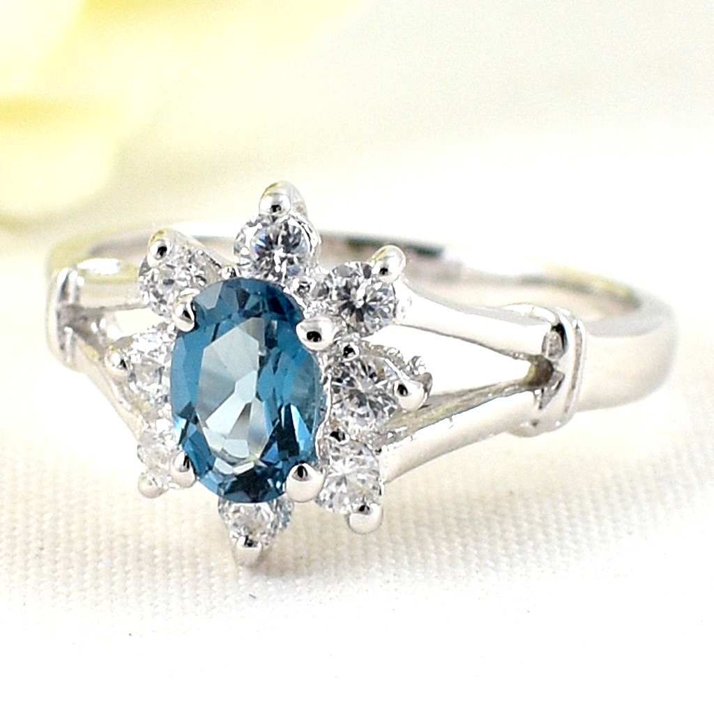 แหวนเงินแท้ราคาถูกชุบทองคำขาว ลอนดอนบลูโทปาซแท้ 0.55 กะรัต เพชรCZ 0.24 กะรัต งานประณีตสวยงาม สั่งผลิตค่ะ