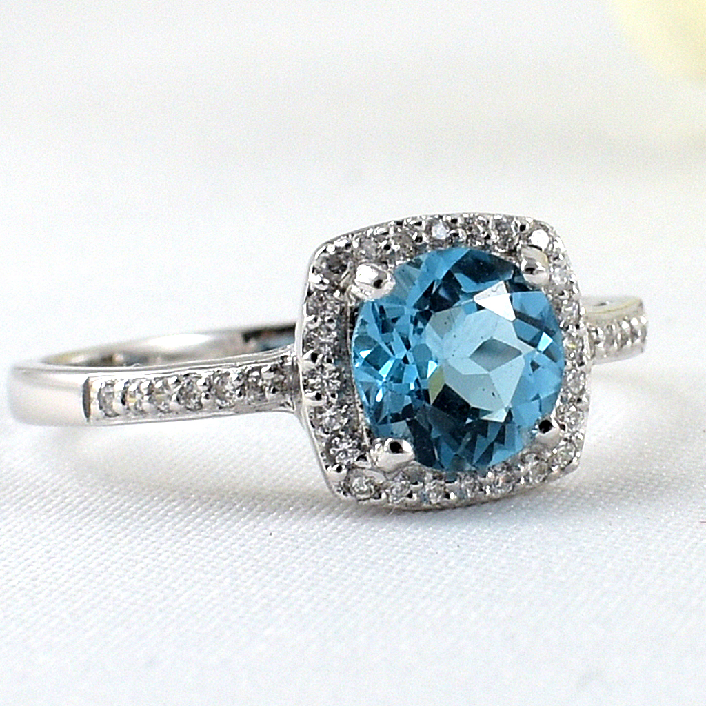 แหวนเงินแท้ราคาถูกชุบทองคำขาว สวิสบลูโทปาซแท้ 1.65 กะรัต เพชรCZ 0.252 กะรัต งานประณีตสวยงาม สั่งผลิตค่ะ