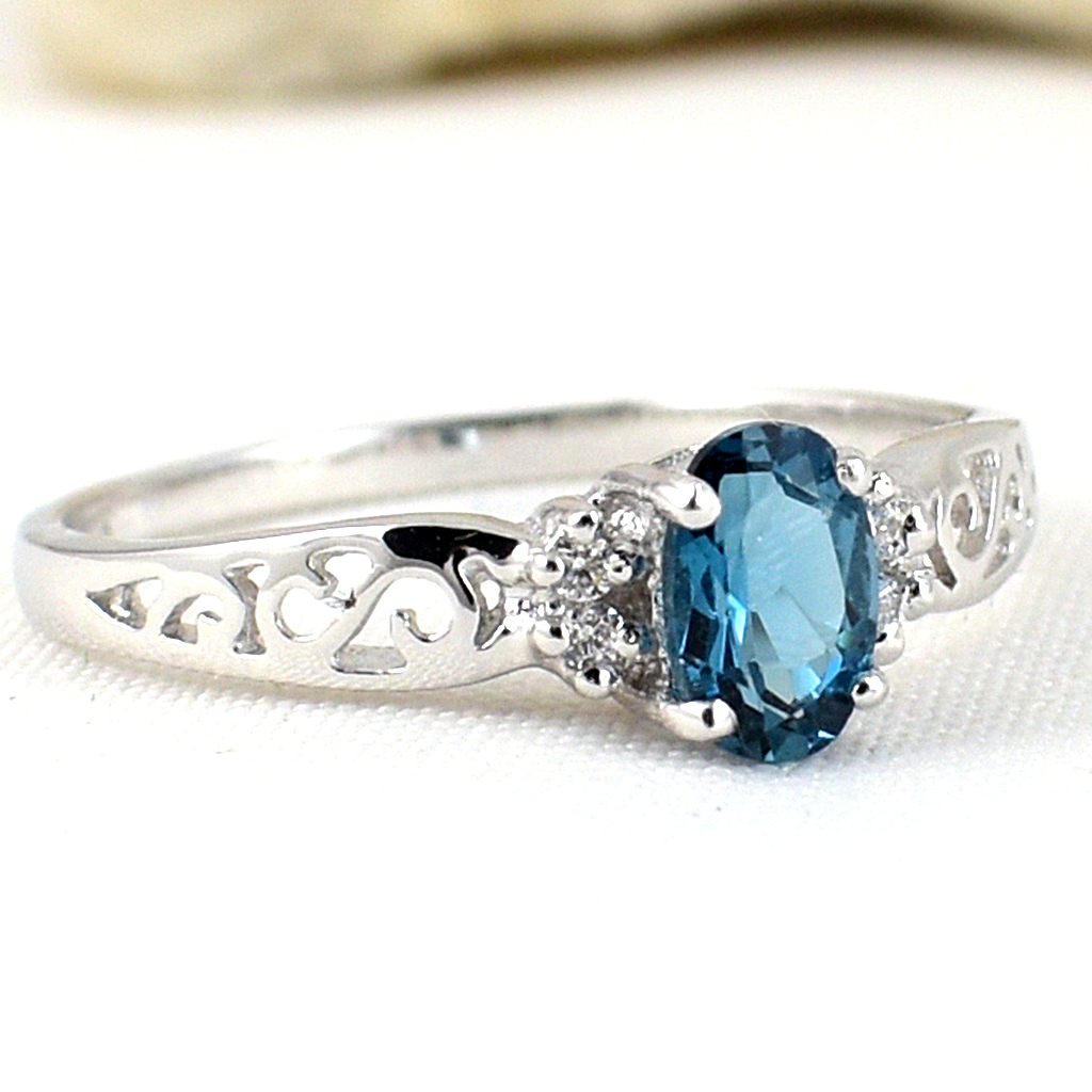 แหวนเงินแท้ราคาถูกชุบทองคำขาว ลอนดอนบลูโทปาซแท้ 0.55 กะรัต เพชรCZ 0.09 กะรัต งานประณีตสวยงาม สั่งผลิตค่ะ