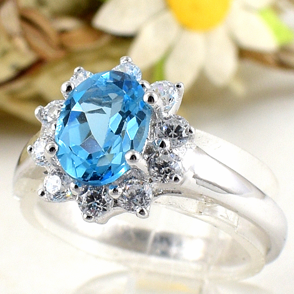 แหวนเงินแท้ราคาถูกชุบทองคำขาว สวิสบลูโทปาซแท้ 1.60 กะรัต เพชรCZ 0.40 กะรัต งานประณีตสวยงาม สั่งผลิตค่ะ