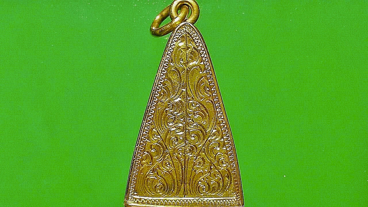 เหรียญพระเจ้าทันใจ วัดพระธาตุปูแจ จ.แพร่ เลี่ยมทองคำปิดหลัง