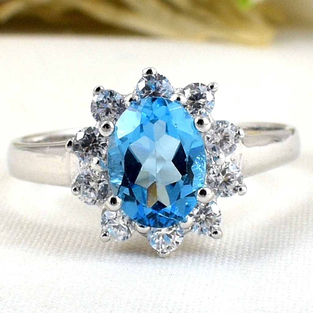 แหวนเงินแท้ราคาถูกชุบทองคำขาว สวิสบลูโทปาซแท้ 1.60 กะรัต เพชรCZ 0.40 กะรัต งานประณีตสวยงาม สั่งผลิตค่ะ