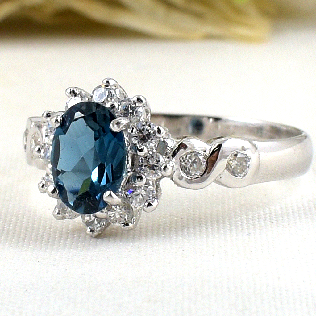 แหวนเงินแท้ราคาถูกชุบทองคำขาว ลอนดอนบลูโทปาซแท้ 0.95 กะรัต เพชรCZ 0.40 กะรัต งานประณีตสวยงาม สั่งผลิตค่ะ