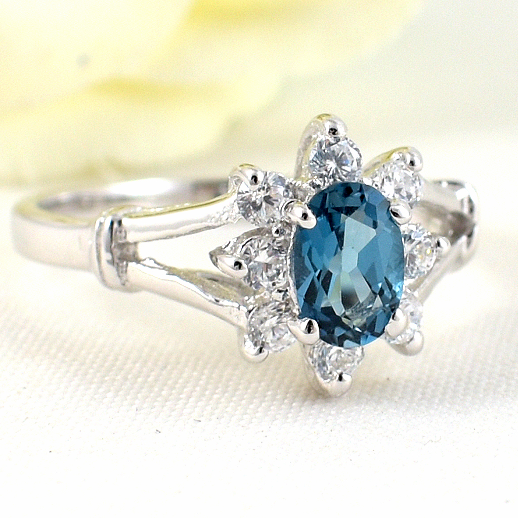 แหวนเงินแท้ราคาถูกชุบทองคำขาว ลอนดอนบลูโทปาซแท้ 0.55 กะรัต เพชรCZ 0.24 กะรัต งานประณีตสวยงาม สั่งผลิตค่ะ