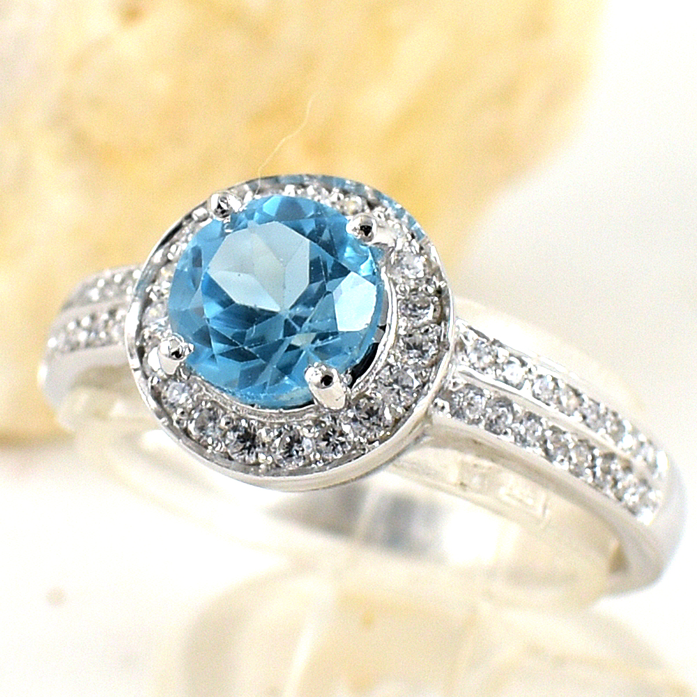 แหวนเงินแท้ราคาถูกชุบทองคำขาว สวิสบลูโทปาซแท้ 1.65 กะรัต เพชรCZ 0.51 กะรัต งานประณีตสวยงาม สั่งผลิตค่ะ