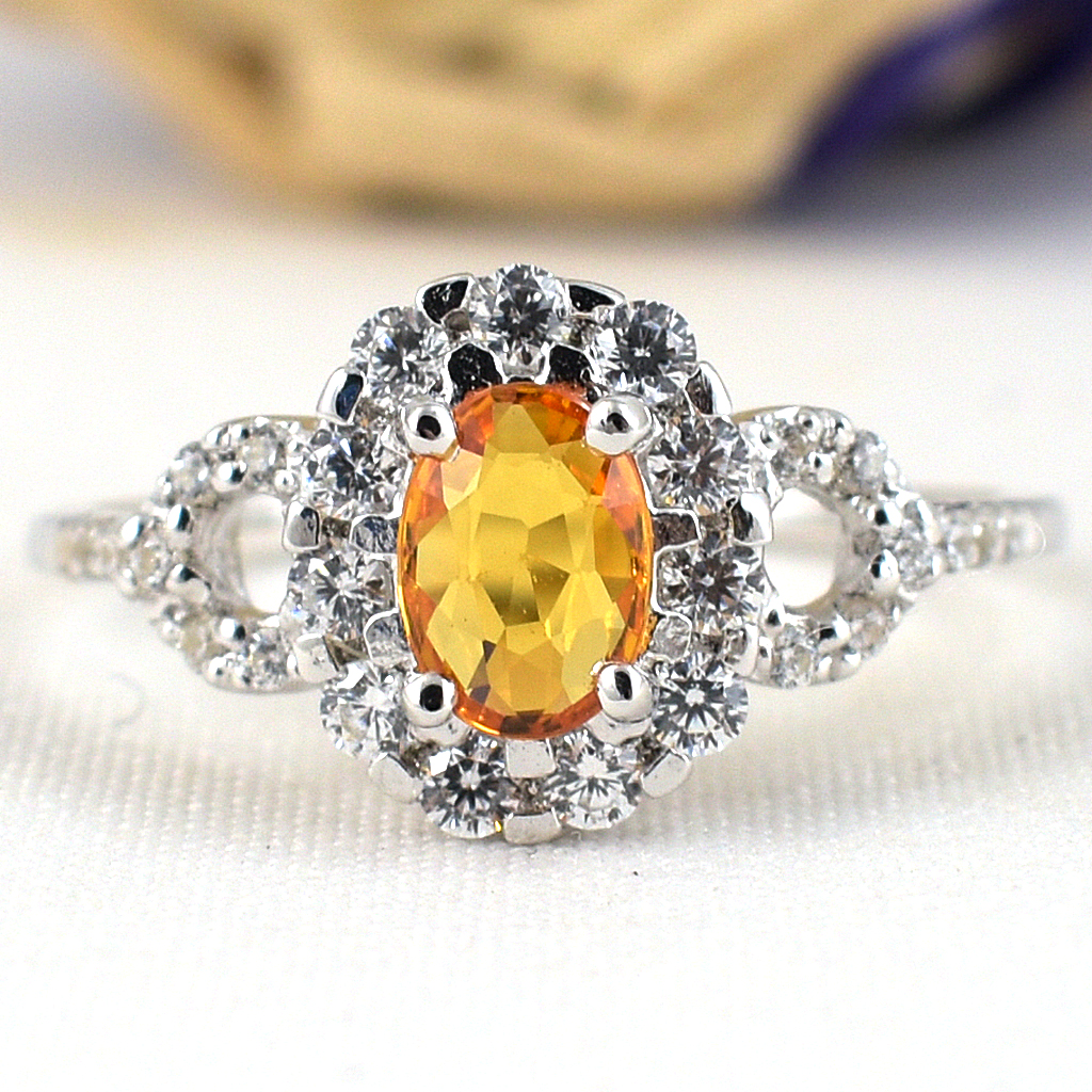 แหวนเงินแท้ราคาถูกชุบทองคำขาว บุษราคัมแท้ 0.60 กะรัต เพชรCZ 1.06 กะรัต งานประณีตสวยงาม สั่งผลิตค่ะ