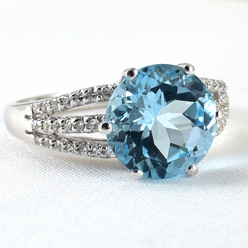 แหวนเงินแท้ราคาถูกชุบทองคำขาว สกายบลูโทปาซแท้ 4.55 กะรัต เพชรCZ 0.322 กะรัต งานประณีตสวยงาม สั่งผลิตค่ะ