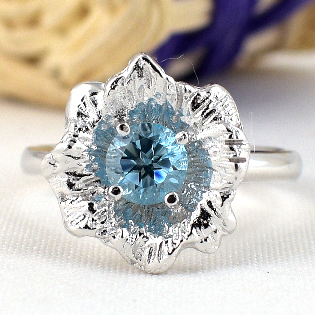 แหวนเงินแท้ราคาถูกชุบทองคำขาว สวิสบลูโทปาซแท้ 0.60 กะรัต งานประณีตสวยงาม สั่งผลิตค่ะ