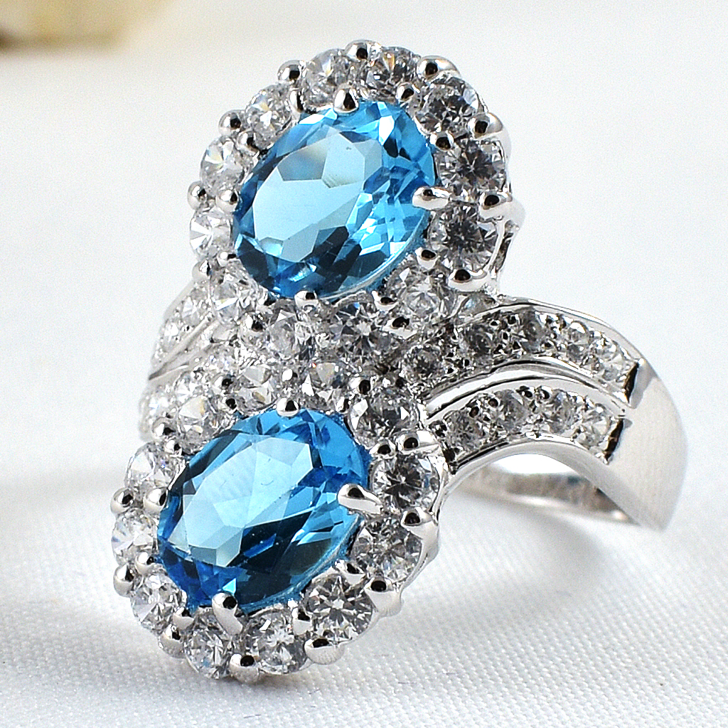 แหวนเงินแท้ราคาถูกชุบทองคำขาว สวิสบลูโทปาซแท้ 3.70 กะรัต เพชรCZ 1.23 กะรัต งานประณีตสวยงาม สั่งผลิตค่ะ