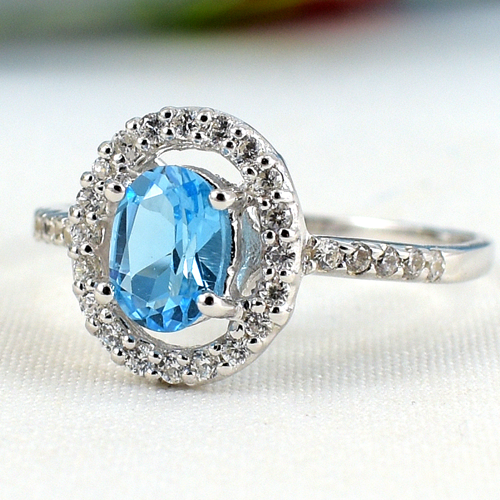 แหวนเงินแท้ราคาถูกชุบทองคำขาว สวิสบลูโทปาซแท้ 0.95 กะรัต เพชรCZ 0.30 กะรัต งานประณีตสวยงาม สั่งผลิตค่ะ