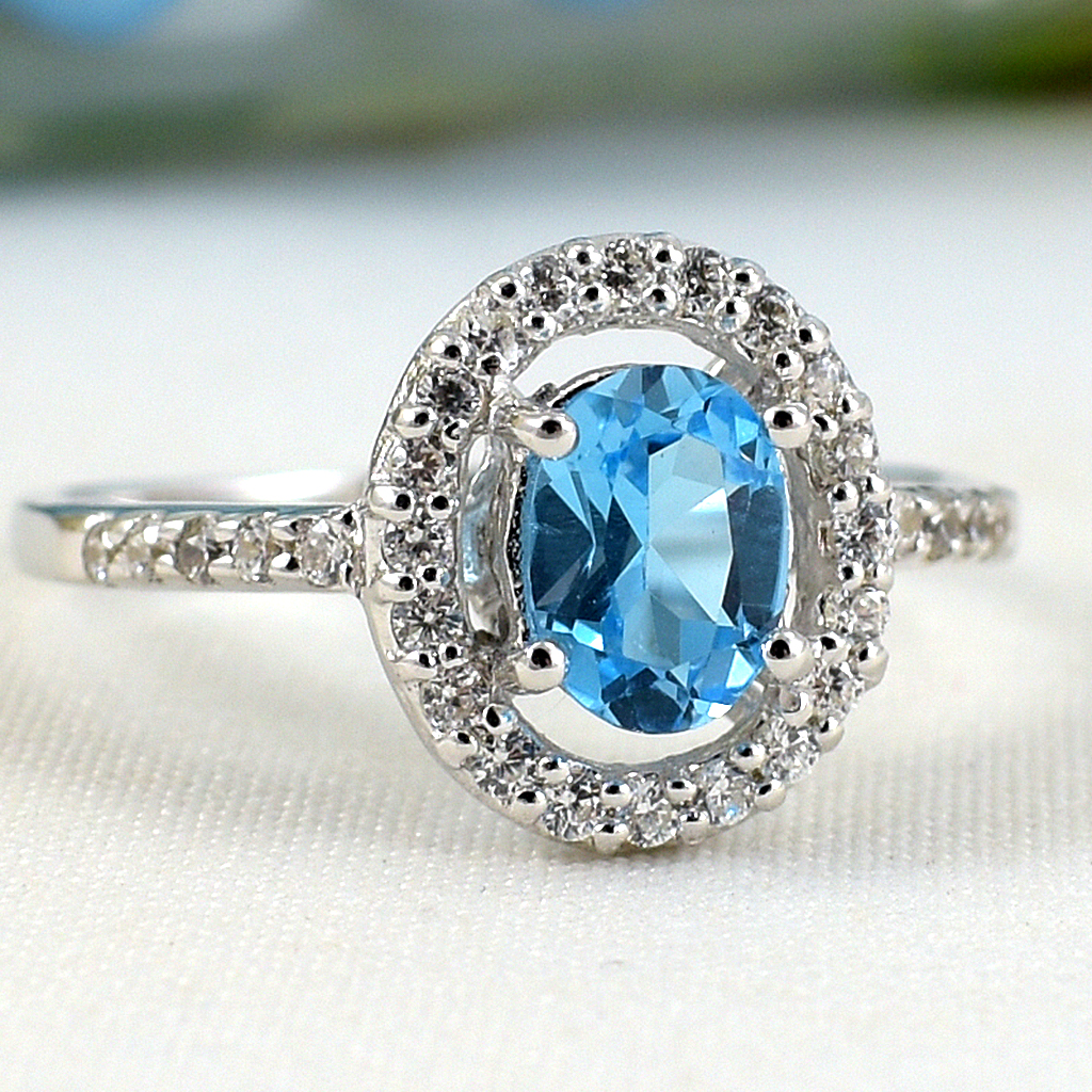 แหวนเงินแท้ราคาถูกชุบทองคำขาว สวิสบลูโทปาซแท้ 0.95 กะรัต เพชรCZ 0.30 กะรัต งานประณีตสวยงาม สั่งผลิตค่ะ