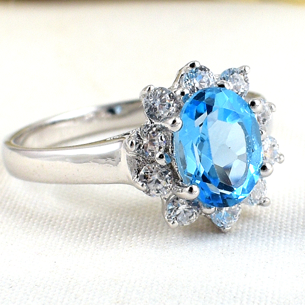 แหวนเงินแท้ราคาถูกชุบทองคำขาว สวิสบลูโทปาซแท้ 1.60 กะรัต เพชรCZ 0.40 กะรัต งานประณีตสวยงาม สั่งผลิตค่ะ