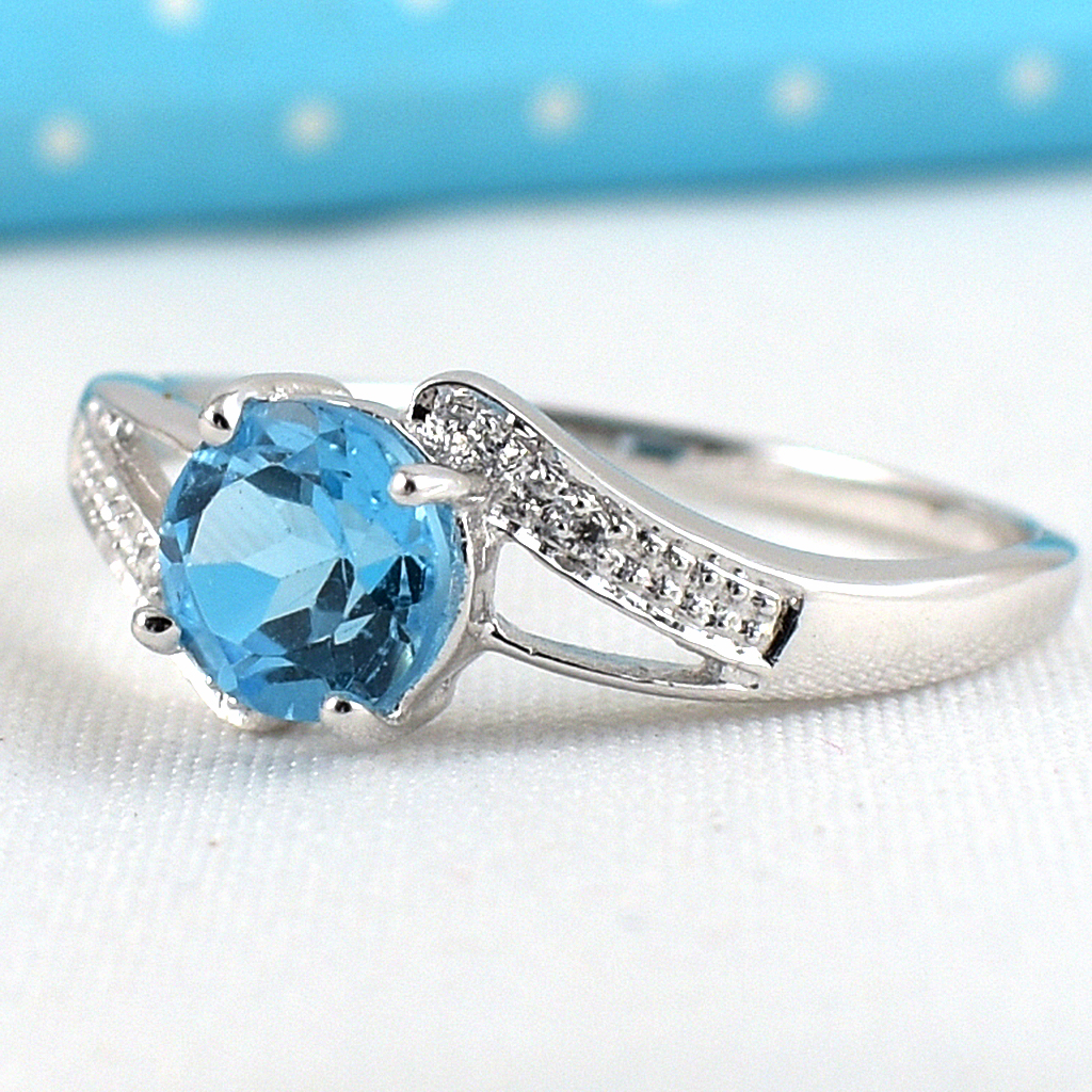 แหวนเงินแท้ราคาถูกชุบทองคำขาว สวิสบลูโทปาซแท้ 0.80 กะรัต เพชรCZ 0.02 กะรัต งานประณีตสวยงาม สั่งผลิตค่ะ