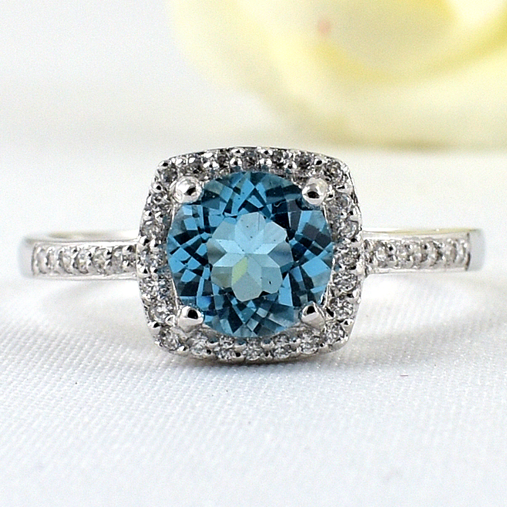 แหวนเงินแท้ราคาถูกชุบทองคำขาว สวิสบลูโทปาซแท้ 1.65 กะรัต เพชรCZ 0.252 กะรัต งานประณีตสวยงาม สั่งผลิตค่ะ