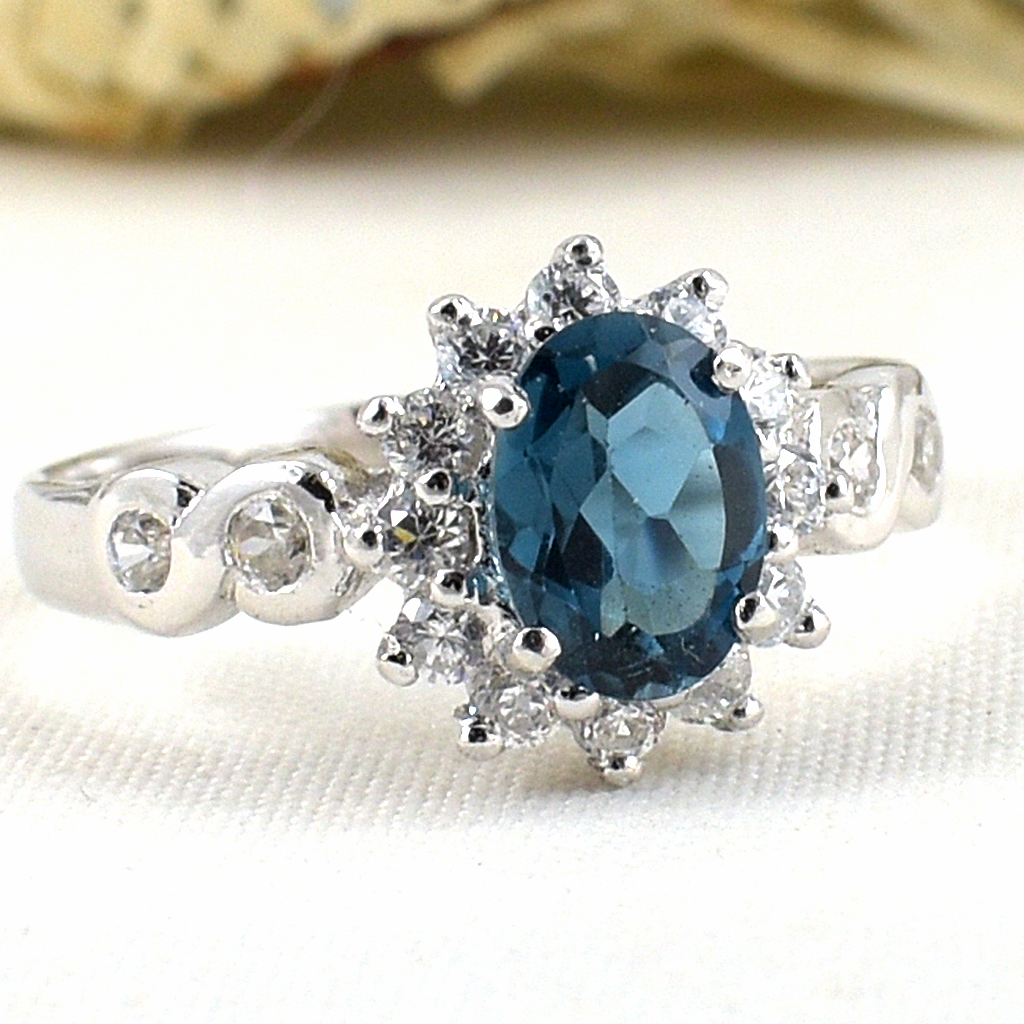 แหวนเงินแท้ราคาถูกชุบทองคำขาว ลอนดอนบลูโทปาซแท้ 0.95 กะรัต เพชรCZ 0.40 กะรัต งานประณีตสวยงาม สั่งผลิตค่ะ