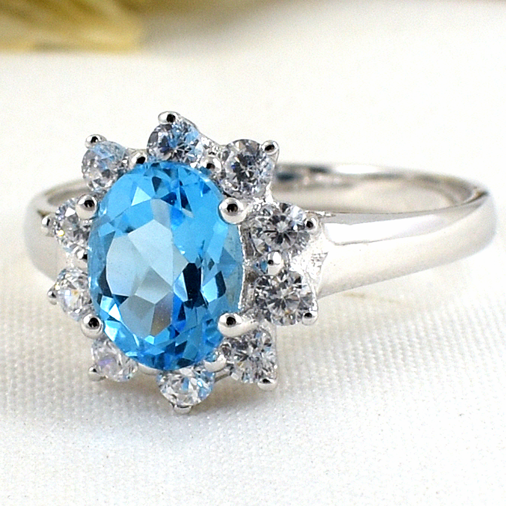 แหวนเงินแท้ราคาถูกชุบทองคำขาว สวิสบลูโทปาซแท้ 1.60 กะรัต เพชรCZ 0.40 กะรัต งานประณีตสวยงาม สั่งผลิตค่ะ