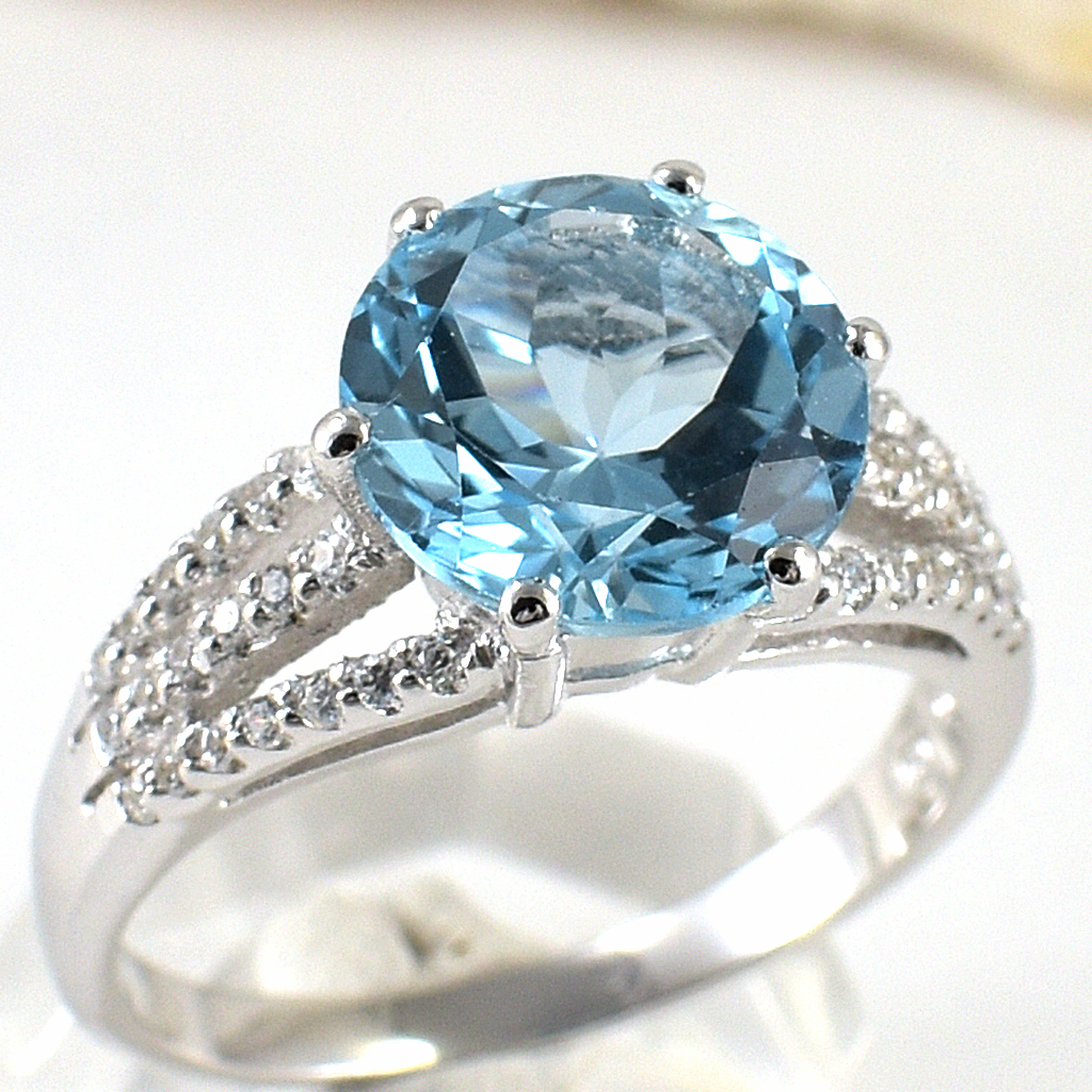 แหวนเงินแท้ราคาถูกชุบทองคำขาว สกายบลูโทปาซแท้ 4.55 กะรัต เพชรCZ 0.322 กะรัต งานประณีตสวยงาม สั่งผลิตค่ะ