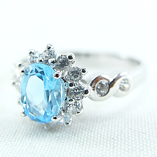 แหวนเงินแท้ราคาถูกชุบทองคำขาว สวิสบลูโทปาซแท้ 0.95 กะรัต เพชรCZ 0.40 กะรัต งานประณีตสวยงาม สั่งผลิตค่ะ