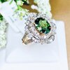 แหวนพลอยเขียวส่องประดับเพชร (Design Cocktail Ring) เขียวส่องเม็ดมาใหม่ สีสวยเหลี่ยมเล่นไฟ เจียระไนแบบเหลี่ยมเพชรรูปไข่ (Oval Shape) ล้อมเพชรสวย ไฟเต็มทุกเม็ด