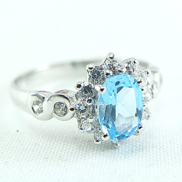 แหวนเงินแท้ราคาถูกชุบทองคำขาว สวิสบลูโทปาซแท้ 0.95 กะรัต เพชรCZ 0.40 กะรัต งานประณีตสวยงาม สั่งผลิตค่ะ