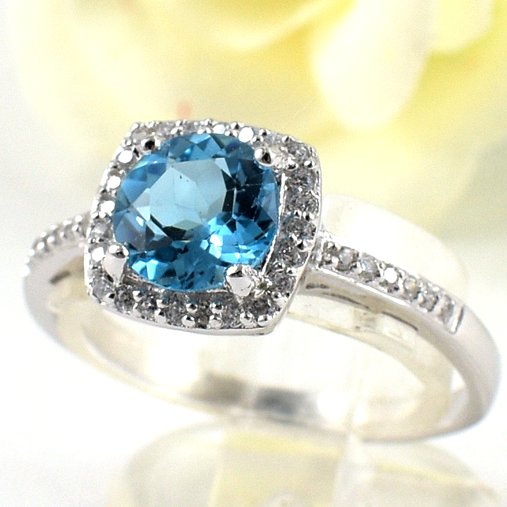 แหวนเงินแท้ราคาถูกชุบทองคำขาว สวิสบลูโทปาซแท้ 1.65 กะรัต เพชรCZ 0.252 กะรัต งานประณีตสวยงาม สั่งผลิตค่ะ