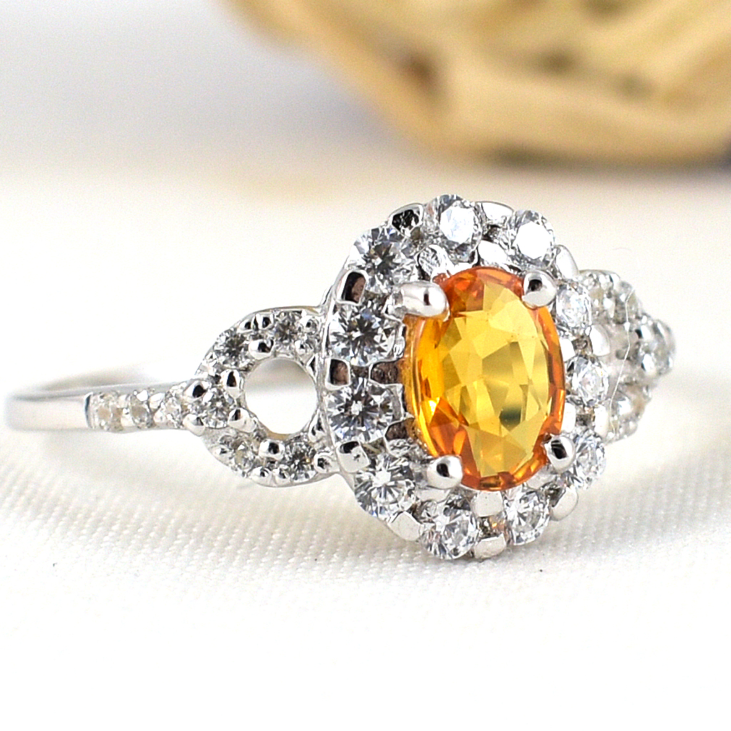 แหวนเงินแท้ราคาถูกชุบทองคำขาว บุษราคัมแท้ 0.60 กะรัต เพชรCZ 1.06 กะรัต งานประณีตสวยงาม สั่งผลิตค่ะ