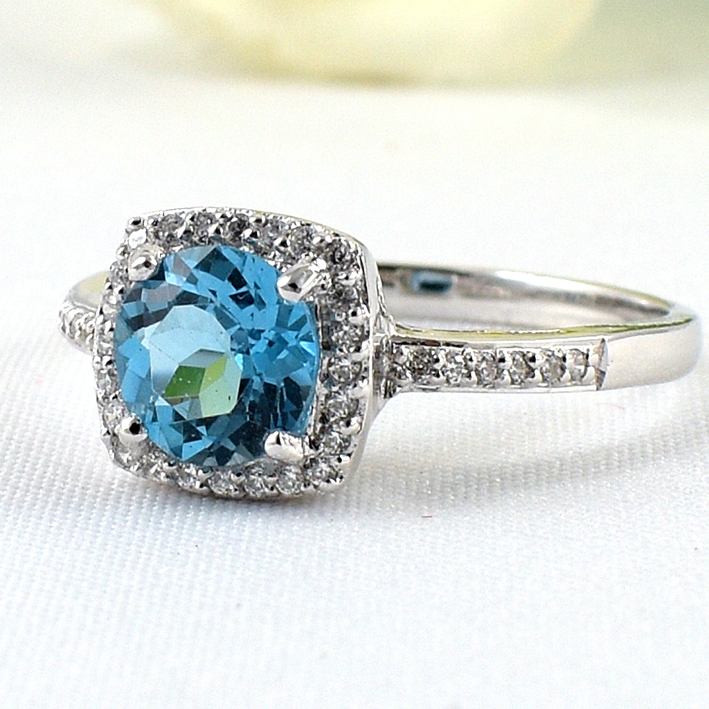 แหวนเงินแท้ราคาถูกชุบทองคำขาว สวิสบลูโทปาซแท้ 1.65 กะรัต เพชรCZ 0.252 กะรัต งานประณีตสวยงาม สั่งผลิตค่ะ