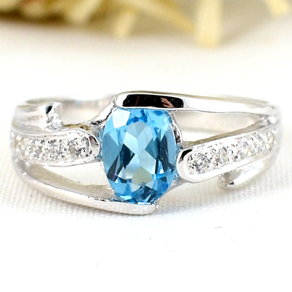 แหวนเงินแท้ราคาถูกชุบทองคำขาว สวิสบลูโทปาซแท้ 0.95 กะรัต เพชรCZ 0.13 กะรัต งานประณีตสวยงาม สั่งผลิตค่ะ