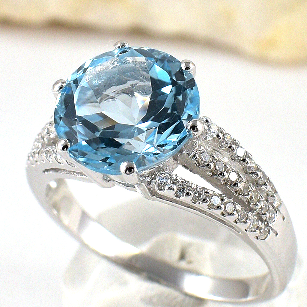 แหวนเงินแท้ราคาถูกชุบทองคำขาว สกายบลูโทปาซแท้ 4.55 กะรัต เพชรCZ 0.322 กะรัต งานประณีตสวยงาม สั่งผลิตค่ะ