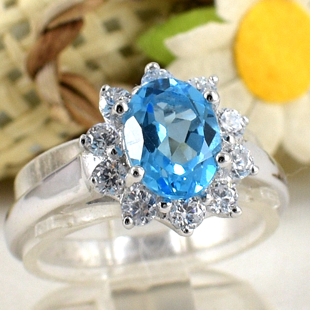 แหวนเงินแท้ราคาถูกชุบทองคำขาว สวิสบลูโทปาซแท้ 1.60 กะรัต เพชรCZ 0.40 กะรัต งานประณีตสวยงาม สั่งผลิตค่ะ