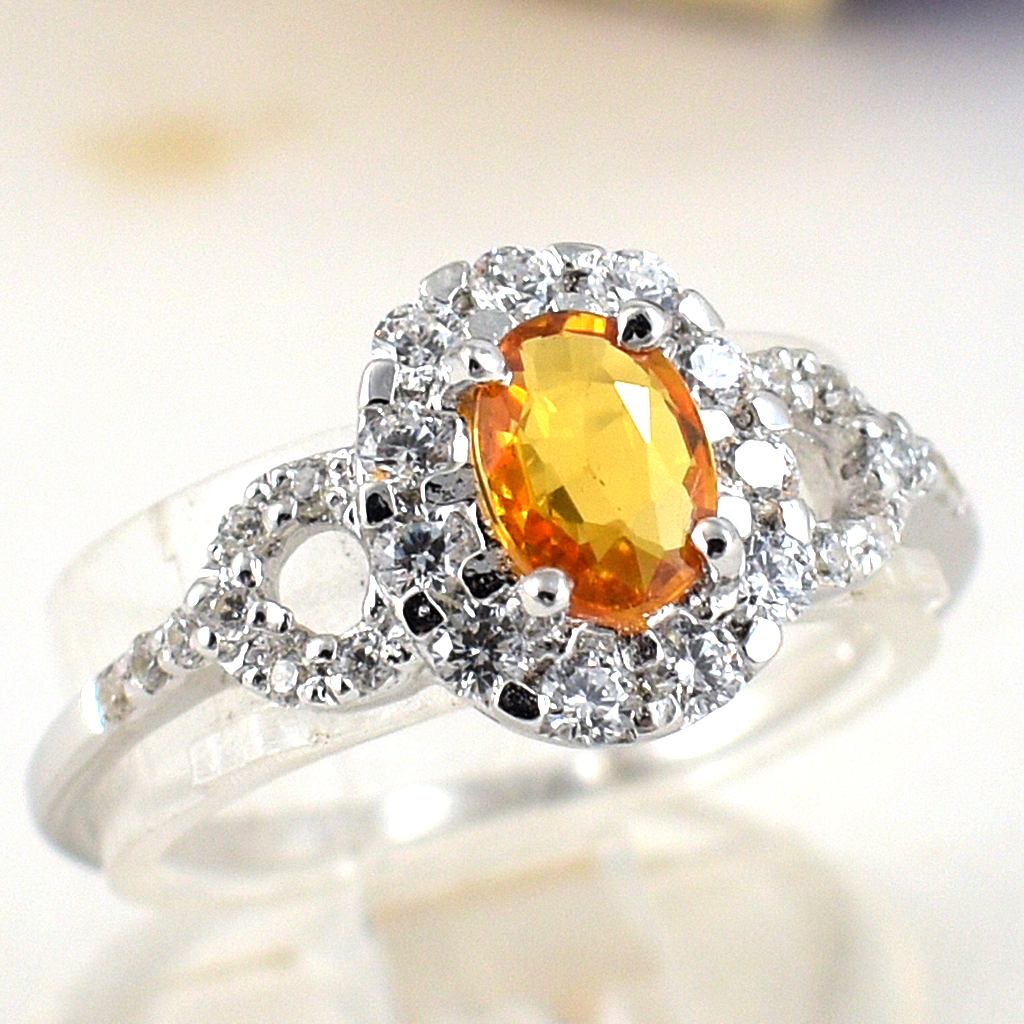 แหวนเงินแท้ราคาถูกชุบทองคำขาว บุษราคัมแท้ 0.60 กะรัต เพชรCZ 1.06 กะรัต งานประณีตสวยงาม สั่งผลิตค่ะ