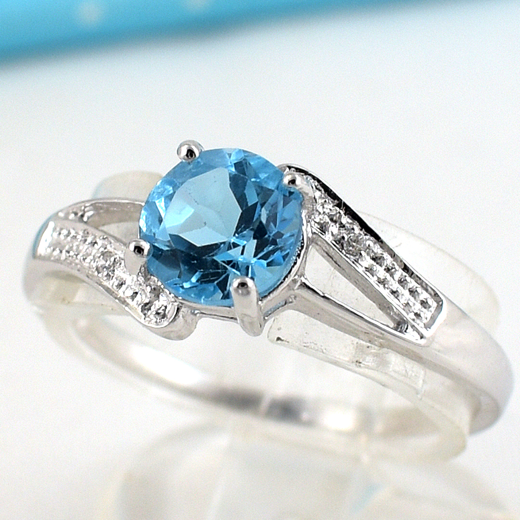 แหวนเงินแท้ราคาถูกชุบทองคำขาว สวิสบลูโทปาซแท้ 0.80 กะรัต เพชรCZ 0.02 กะรัต งานประณีตสวยงาม สั่งผลิตค่ะ