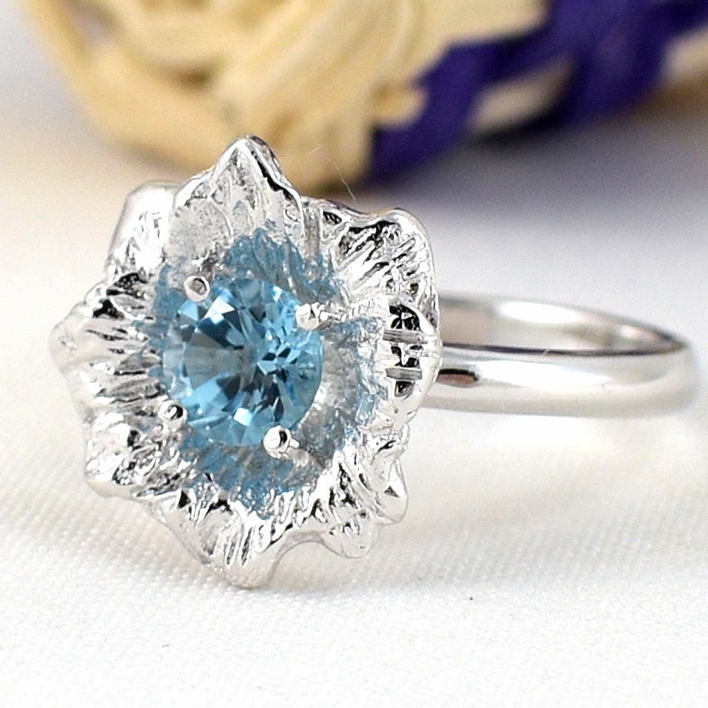 แหวนเงินแท้ราคาถูกชุบทองคำขาว สวิสบลูโทปาซแท้ 0.60 กะรัต งานประณีตสวยงาม สั่งผลิตค่ะ