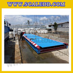 เครื่องชั่งรถบรรทุกขนาด 100 ตัน โครงสร้างแท่นชั่งทำจากเหล็กขนาด 3x18 เมตร ค่าละเอียด 10 กิโลกรัม แบบพื้นแท่นชั่งหน้าเหล็ก