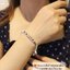 สร้อยข้อมือเงินแท้ งานสุโขทัย-กึ่งกำไล ลายโซ่ร้อยตุ้งติ้งถุงเงินลงยา 6 ชิ้น หนัก 1 บาท (เนื้อเงินแท้)