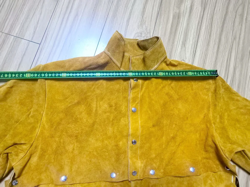 เสื้อแจ็คเก็ตหนังครึ่งตัวติดกระดุมแป๊กถอดได้ด้านหลังเป็นยางยืด กันความร้อนประกายไฟสะเก็ดไฟงานเชื่อม Half Jacket Cowhide Bib Snap fastener Back is elastic Fire-Resistant Welding Protection